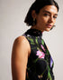 DEMITRI-Tops-The ultimate wardrobe staple, DEMITRI has it all. The scattered bouquet print and oversized self-tie fastening are the perfect combination for a stylish look that will elevate whatever jeans, skirt or trousers you pair with it. The fabric of this product is made with 100% recycled polyester. Using recycled polyester helps divert plastic waste from ending in landfills, and helps us to reduce our dependence on virgin materials. Sleeveless top Scattered bouquet print Cowl neck Oversized self-tie f